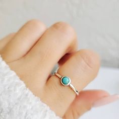 Genuine Turquoise Sterling Silver Ring~ Top Of Ring Height: 2.7mm Width: 5.2mm Band Width: 1.3mm Center Stone Size: 3.7mm Stone Shape: Round Genuine Turquoise Total Number Of Stones: 1 Metal: 925 Sterling Silver Finish: High Polish 925 Stamped Stackable Sterling Silver Turquoise Ring, Minimalist Stackable Turquoise Ring For Anniversary, Dainty Adjustable Turquoise Promise Ring, Luxury Stackable Turquoise Ring In Sterling Silver, Adjustable Turquoise Ring For Everyday Wear, Minimalist Adjustable Turquoise Ring For Everyday, Minimalist Turquoise Jewelry For Anniversary, Turquoise Minimalist Jewelry For Anniversary, Adjustable Sterling Silver Turquoise Birthstone Ring