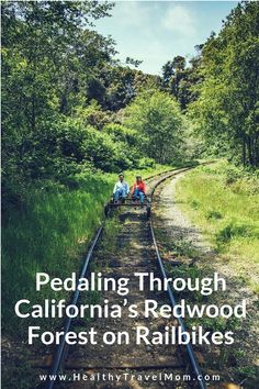 two people riding on the back of a train track with text reading pedaling through california's redwood forests on rails