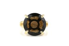 A selection from Anemone's array of statement rings for women made with a round Smoky Quartz, held by a premium quality 14k gold-filled double ring band. The gemstone in this 14k jewelry is also known as a power stone and protective stone. This dark brown Smoky Quartz ring makes a perfect gift for a loved one or for yourself. ☛ 𝒜𝐵𝒞 - Add Engraving - https://etsy.me/2ZSRjhu ☛ Ring size - Select the size you would like from the drop down menu ♥ Gemstone Type - Smoky Quartz ♥ Gemstone Size - 16m Dainty Rings, Smoky Quartz Ring, Brown Gemstone, Power Stone, Gold Statement Ring, Fancy Gifts, Gold Gemstone Ring, Gold Cocktail Ring, Gold Cocktail