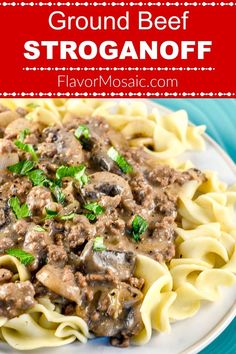 a white plate topped with pasta covered in mushroom sauce