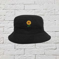 Embroidered Sunflower on black bucket hat - DSY Lifestyle Sunflower Bucket Hat, Sunflower Bucket, Bucket Hat Style, Bucket Hat Summer, Embroidered Bucket Hat, Hat Flower, Bucket Cap, Bucket Hat Black, White Camo