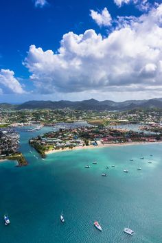 an aerial view of boats in the water