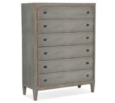 an old gray dresser with five drawers