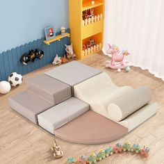 a child's play room with toys, bookshelves and other items on the floor