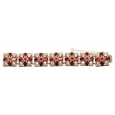 Vintage Gold Tone Diamante Red Flower Square Prong Set Bracelet Circa 1940s. This bracelet has layers of gorgeousness. it has links of squares and in each square there are 4 round stones of diamantes that are all prong set. Then on top of that are four long emerald cuts of red diamantes and then on top of that is set a gold flower that has a red diamante set in that. This is a 1940's beauty that is set like fine jewelry and looks like it. It is in such great shape and just magical. One of my favorite pieces in the collection. This is a special bracelet! Set Bracelet, American Modern, Gold Flower, Red Flower, Gold Flowers, Red Flowers, Link Bracelets, Vintage Gold, Prong Setting