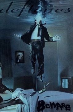 a man jumping in the air over a bed