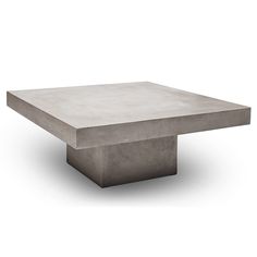 a square concrete table on an isolated white background with no people in the room around it