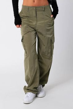 These silky cargo pants are perfect for everyday, featuring a low rise and ankle tie ups for a cool casual look! Fabric Details: 100% Nylon Care Instructions: Machine wash cold, tumble dry low Cute Crop Tops, Cargo Pant, Pair Of Pants, Staple Pieces, How To Feel Beautiful, Quality Clothing, Modern Woman, Cargo Pants, Clothes For Sale