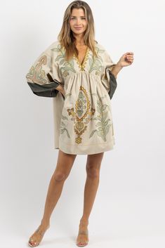 Embroidered V-neck Vacation Dress, Bohemian V-neck Embroidered Dress For Brunch, Bohemian Beige Mini Dress, Embroidered Mini Dress For Vacation, Beige V-neck Mini Dress For Vacation, Embroidered Mini Dress For Fall, Spring Embroidered Beach Mini Dress, Spring Beach Embroidered Mini Dress, Beige V-neck Dress With Floral Embroidery