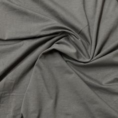 a close up view of a plain grey fabric