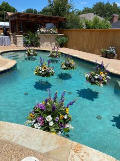 an empty pool with flowers in the middle