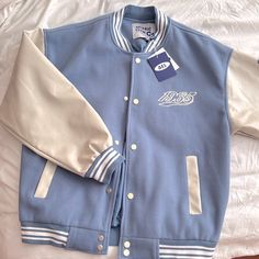 Brand New, Never Worn Cheap Winter Varsity Jacket With Button Closure, Pastel Varsity Jacket, Trendy Blue Outerwear With Letter Print, Blue Cotton Outerwear With Letter Print, Blue Patchwork Varsity Jacket For Streetwear, Trendy Blue Varsity Jacket With Letter Print, Blue Outerwear With Letter Print For Spring, Blue Letter Print Outerwear For Spring, Winter Blue Outerwear With Letter Print