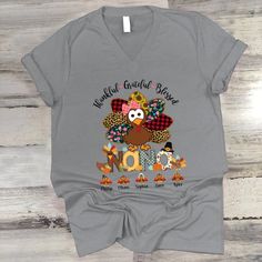 Thankful Greatful Blessed Nana Turkey 2022 V-NeckIf you looking for a personalized t-shirt to show your love to your family, it's will be best choice. Our?ÿV-Neck T-Shirt serves as the perfect short-sleeved shirt for your unique, funny, or personalized designs. Features such as a lay flat collar and a?ÿV-Neck feminine cut will make this your new favorite t-shirt. Brand:?ÿFruit 100% Cotton Size up if you want something roomier Machine wash cold inside out with like colors, tumble dry low for easy Thankful Greatful Blessed, Present For Grandparents, Viking Designs, Parents Day, Grateful Thankful Blessed, Flat Collar, Personalized Grandma, Grandparents Day, Thanksgiving Shirts