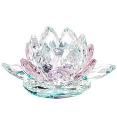 a crystal lotus flower with pink and green leaves on the bottom, in front of a white background