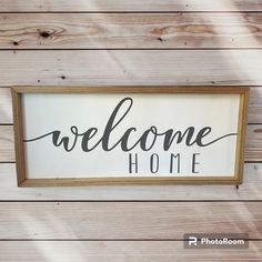 a wooden sign that says welcome home