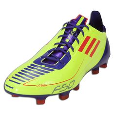 a soccer shoe with purple and orange stripes