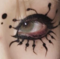 a woman's eye with black ink on her face and the words scum - bucket