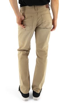 A staple for everyday casual looks, these tapered jeans offer all-day comfort with durable, garment-dyed stretch denim and extra room in the seat and thigh. 14 1/2" leg opening; 10 3/4" front rise Zip fly with button closure Five-pocket style 98% cotton, 2% spandex Machine wash, tumble dry Imported Casual Chino Cotton Twill Jeans With Tapered Leg, Casual Tapered Leg Jeans In Chino Cotton Twill, Casual Tapered Leg Chino Twill Jeans, Solid Color Tapered Leg Jeans With Five Pockets, Casual Jeans With 5-inch Inseam, Classic Everyday Jeans In Chino Cotton Twill, Everyday Straight Leg Bottoms With Pockets, Relaxed Fit Chino Cotton Twill Jeans For Everyday, Casual Straight Chinos With Five Pockets