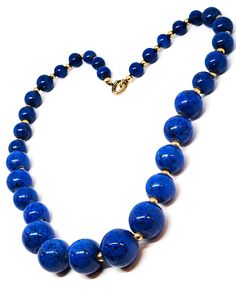 Art Deco Simmons gold filled and blue graduated beaded chain link vintage necklace. Beautiful blue graduated beads are strung on a gold filled chain. Each bead is separated by a small gold filled accent. Antique sport ring clasp. Signed Simmons on the jump ring. Good vintage condition with little signs of normal vintage wear. Necklace measures 16 inches in length. Classic Blue Round Bead Jewelry, Classic Blue Round Beads Jewelry, Vintage Blue Single Strand Jewelry, Vintage Round Hand-strung Jewelry, Blue Beaded Chain Jewelry, Blue Beaded Round Jewelry, Vintage Beaded Chain Jewelry, Vintage Round Beaded Chain Jewelry, Vintage Blue Hand-strung Beaded Necklaces