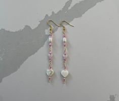 Dainty dangly heart chain earrings! Pearly hearts and beads with pink accents on gold hooks and wire, about 3.5 in. Pink Beaded Chain Dangle Earrings, Pink Dangle Beaded Earrings For Valentine's Day, Gold Beaded Dangle Heart Earrings, Gold Hooks, Heart Chain, Handmade Jewelry Diy, Pink Accents, Pink Earrings, Chain Earrings