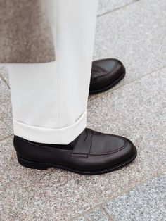 Launched in 2017, The Penny Loafer is our take on a classic staple — Refined and developed for over five years, resulting in a contemporary silhouette that works great with both casual and formal outfits. A superb partner for everyday wear, handcrafted in Almansa with a Goodyear welt, ensuring you can wear them for years to come.    Fits large in size  We recommend selecting half a size down from what you usually wear in lace-up shoes. Please refer to our Size Guide above or reach out to our cus Goodyear Welted Loafers For Business Casual In Fall, Classic Brogue Detailed Moccasins For Work, Timeless Goodyear Welted Moccasins For Office, Timeless Wingtip Tassel Loafers For Work, Goodyear Welted Loafers For Business In Fall, Timeless Moc Toe Tassel Loafers For Business Casual, Wingtip Tassel Loafers For Workwear, Classic Goodyear Welted Loafers For Semi-formal Occasion, Timeless Business Casual Tassel Loafers With Moc Toe