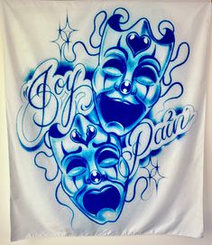 two blue masks on a white banner with the words go for it