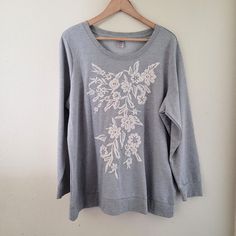 Cute Pullover Embroidered Gray Sweatshirt With Embellishment Details. Size 18/20, 24 Inch Chest, 28 Inch Long From Shoulder To Hem, And 24 Inch Length Of Sleeve. -A Relaxed Fit Floral Embroidery Tops With Crew Neck, Relaxed Fit Crew Neck Tops With Floral Embroidery, Relaxed Fit Floral Embroidered Crew Neck Tops, Relaxed Fit Embroidered Tops For Loungewear, Embroidered Tops For Spring Loungewear, Spring Embroidered Tops For Loungewear, Embroidered Long Sleeve Tops For Loungewear, Spring Long Sleeve Tops With Embroidered Graphics, Embroidered Relaxed Fit Sweater For Spring