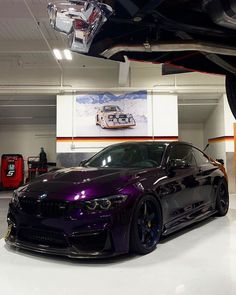 a purple car is parked in a garage