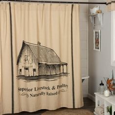 a bathroom with a shower curtain that has an image of a barn on it and the words supervisor livestock & poultry naturally raised