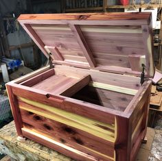 an open wooden box sitting on top of a table