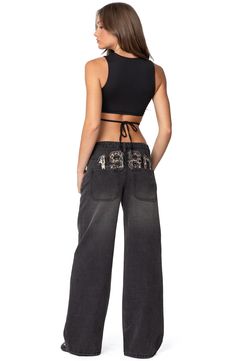 Amp up your casual-cool game in these nonstretch wide-leg jeans designed with a low rise and a leopard date stamp on the back. Zip fly with button closure Five-pocket style 100% cotton Machine wash, dry flat Imported Low Weast Jeans, Low V Pants, Low Rise Jeans Nordstrom, Very Low Rise Pants, Low Risecargo Pants, Low Riders Jeans, Lace Up Waist Jeans, Butterfly Low Rise Jeans, Edikted Jeans