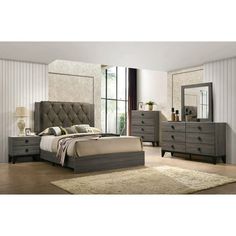 a bedroom scene with focus on the bed and dressers, mirror and nightstand unit