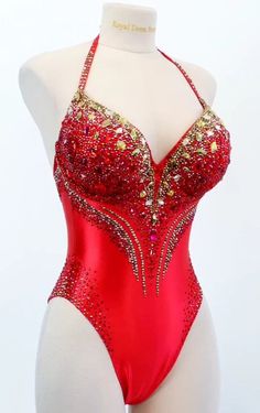 This bodysuit is a lavish masterpiece with its rich scarlet satin adorned by opulent golden rhinestones. The sparkling gold rhinestones create a striking and luxurious contrast against the bold red fabric, making it a statement piece.  Production time excluding delivery: finished design - 4-5 weeks; custom design 2-3 months. ----------------------------------------------------- We invite you to see other offers of our store. Red Monokini, Competition Satin Bodysuit, Bodysuit for a fitness model, Red Performance Outfits, Golden Bodysuit, Red Bodysuit Outfit, Lace Bodysuit Outfit, Red Monokini, Sparkly Bodysuit, Heart Bodysuit, Satin Bodysuit, Corset Bodysuit