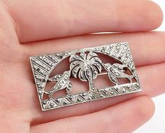 925 Sterling Silver - Vintage Sparkling Palm Tree & Birds Brooch Pin - BP1920  925 Sterling Silver - Vintage Sparkling Palm Tree & Birds Brooch Pin - BP1920  Jewelry Type:         Brooch Pin   Metal Type:            925 Silver  Metal Size:             1.5"  Stone Type:            N/A  Condition:              N/A  Jewelry Weight:     8.7 Grams  PLEASE NOTE: THIS ITEM IS PRE-OWNED. ALTHOUGH MOST ITEMS ARE IN VERY GOOD CONDITION, SOME MAY NEED CLEANING AND/OR MINOR REPAIRS. WE MAKE A VERY STRONG EF Estate Style Silver Jewelry For Gifts, Estate Style Silver Jewelry Gift, Bird Tree, Bird Brooch, Palm Tree, Palm Trees, Beautiful Rings, Types Of Metal, Brooch Pin