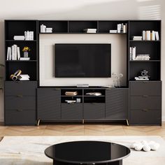 an entertainment center with bookshelves and a flat screen tv