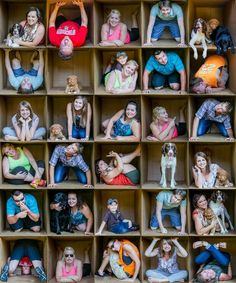 a group of people sitting on top of wooden boxes with dogs and cats in them