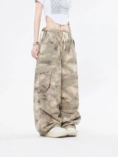 Embrace the street aesthetic with our Faded Baggy Camo Cargo Pants, perfect for making a statement while on the move.
Designed with a natural waist, these cargo pants offer a blend of comfort and durability. The camouflage pattern adds an edgy touch, while the drawstring and convenient pockets provide functionality and ease. The relaxed wide-leg silhouette ensures a nonchalant yet purposeful style, tailored for the contemporary wardrobe.
Pair them with a cropped hoodie and sneakers for running e Utility Wide Leg Cargo Pants For Streetwear, Spring Cotton Combat Cargo Pants, Utility Wide Leg Pants For Streetwear, Spring Combat Cotton Cargo Pants, Utility Style Wide Leg Pants For Streetwear, Casual Wide Leg Pants With Cargo Pockets For Streetwear, Wide Leg Streetwear Pants With Drawstring, Baggy Y2k Wide Leg Pants With Pockets, Wide Leg Pants With Drawstring For Streetwear