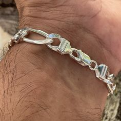 This is the bracelet the man in your life has been waiting for. It's a classic Hawaiian Scroll design just for him. The width and weight of the bar matched with the hefty 10mm Figaro Link Chain create a very masculine I.D. Bracelet he'll love. Wear it as is - or it can be custom engraved with a name or a meaningful word up to 12 characters. 10mm Bar with Scroll design Front can be custom engraved with name included in price Figaro Link Chain with two link sizes Available in size 8 or size 9 Lobs Word Up, Scroll Design, 925 Sterling Silver Chain, Meaningful Words, Custom Engraving, Infinity Bracelet, The Bar, Link Chain, Sterling Silver Chains