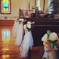 flowers are placed on the pews in a church