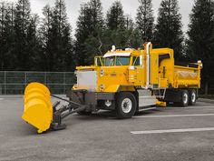 a large yellow truck parked in a parking lot