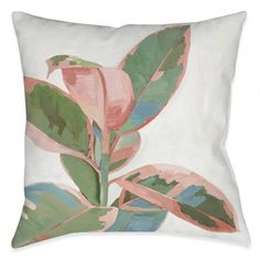 a white pillow with pink and green leaves on the front, against a white background