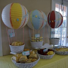 hot air balloons and desserts on a table