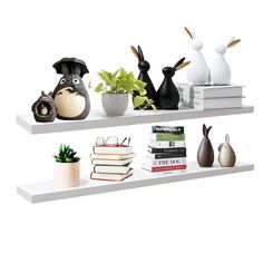 three shelves with books, vases and figurines on top of each shelf