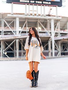 Get your game on with the Vols Helmet Fade Oversized Tee! This officially licensed shirt gives you an old school look while showing your love for the University of Tennessee. With a quirky style and playful tone, this tee is perfect for any true fan. Go Vols! Oversized T-shirt For Game Day In Fall, Oversized Fall T-shirt For College, Oversized College Style T-shirt For Fall, Oversized Fall College Style T-shirt, College Style T-shirt For Game Day In Fall, Oversized Collegiate T-shirt For Game Day, Collegiate Fan Merchandise T-shirt For Fall, Collegiate Fall Fan Merchandise T-shirt, Retro Oversized Tops For Game Day