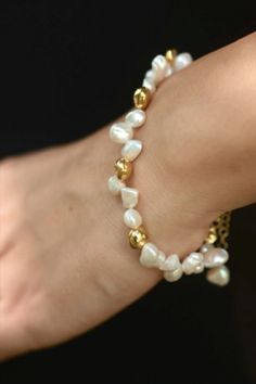 This handmade freshwater pearl bracelet is made of 8-9 mm irregular shape natural keshi pearls. I also used 4 pieces of 14k gold-plated or silver plated real keshi pearl beads in order to add a different and elegant look to the design. The clasp is either a 925 sterling silver spring ring clasp or a 14k gold plated on 925 sterling silver, according to your choice of material. The clasp has an adjustable length of 2 inches. Bridal Pearl Bracelet, Pearl Bracelets, Freshwater Pearl Bracelet, Keshi Pearls, Silver Spring, Gemstone Bracelets