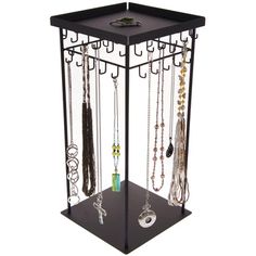 a jewelry rack with multiple necklaces hanging from it's sides and two shelves on each side