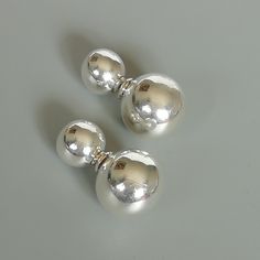 A pair of sterling silver ball studs. The small ball can be inserted into the big ball for closure. Dimensions: Small ball: 8mm Big ball: 12mm. Length: 21mm Weight: 3.60gm Price listed is for a PAIR of hoops. These earrings are made of 925 hypoallergenic sterling silver Can be packaged in a gift box. I can include a personal message from you if needed You are welcome to contact me at... bhavnakwintra1956@gmail.com For more beautiful pieces from my shop, please browse 👇 TOE RINGS: https://www.et Classic Silver Single Cartilage Earring, Classic Silver Internally Threaded Cartilage Earrings, Classic Silver Piercings For Everyday, Classic Silver Everyday Piercings, Classic Silver Pierced Plug Earrings, Classic Silver Internally Threaded Piercings, Elegant Silver Hypoallergenic Piercings, Modern Silver Internally Threaded Cartilage Earrings, Modern Silver Cartilage Earrings