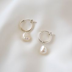 Sleek and subtle, these hoop earrings showcase the irregularities and organic form of these keshi pearls. Made of sterling silver and genuine freshwater pearls. Hoop measures 15mm in diameter while pearls measure 7-9mm in diameter. --------------------♥ PROMOS ♥-------------------- Want 10% off? Join the mailing list by visiting http://bit.ly/vedern . Just leave me a note at checkout if you have any problems applying discount codes. --------------------♥ BUY WITH CONFIDENCE ♥-------------------- Silver Earrings With Pearls, Silver Earrings Pearl, Dainty Silver Earrings Aesthetic, Pearl And Silver Earrings, Minimal Silver Earrings, Pearl Drop Earrings Silver, Nickel-free White Hoop Earrings For Anniversary, Nickel-free White Hoop Pearl Earrings, White Small Hoop Pearl Earrings