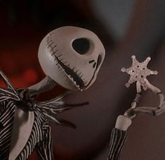 an animated skeleton holding a snowflake in its hand