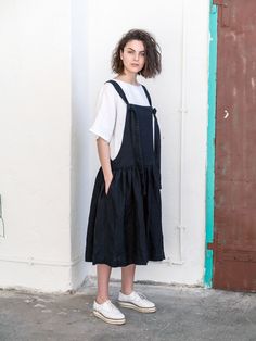 Black linen pinafore dress made of soft linen-like retro Japan-style apron, with regulated length straps and extra-wide charming skirt with side pockets for your everydays comfort. Maternity dress can be worn not only on sunny days, but you can also pair it with any favourite top or jacket. The Wide pinafore dress can be worn on many occasions with different styles of shoes and accessories. Made from washed linen, this dress will fit you on any occasion. Wear with sandals for a relaxed sense of Black Cotton Pinafore Dress For Summer, Cotton Pinafore Dress For Daywear, Summer Bib Front Dress With Pockets, Cotton Sundress Pinafore Dress, Sleeveless Linen Pinafore Dress With Pockets, Summer Linen Pinafore Dress, Sleeveless Linen Pinafore Dress, Linen Pinafore Dress, Linen Pinafore